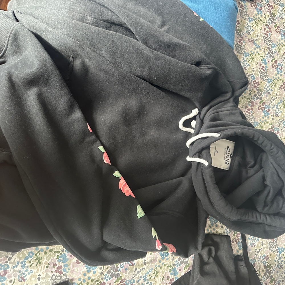 Hollister Black Sweater with Pink Floral Accents